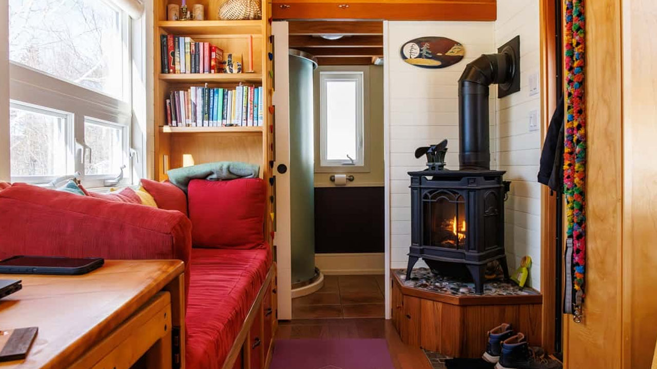 Breton-Tiny-House-by--by-Howling-Dog-Construction_with lounge area, fireplace and guest loft