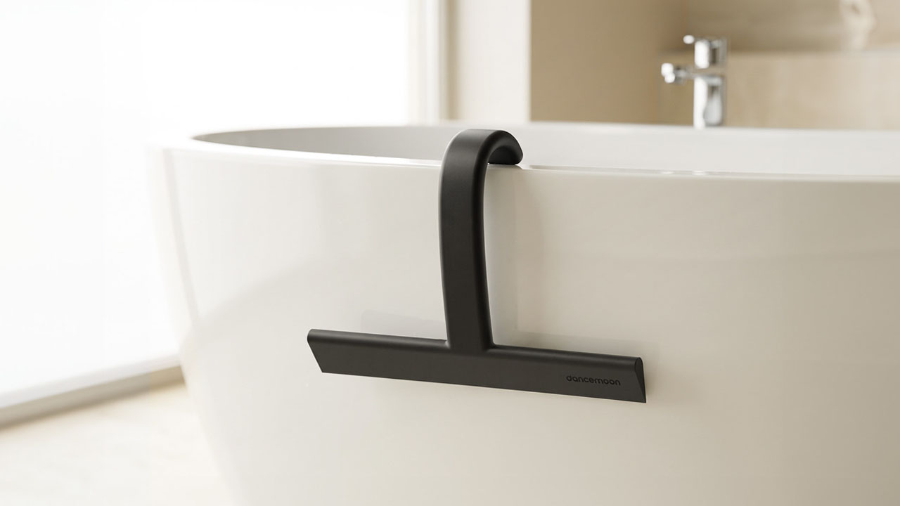 JustHang Compact Squeegee_hanging within reach in a bathroom