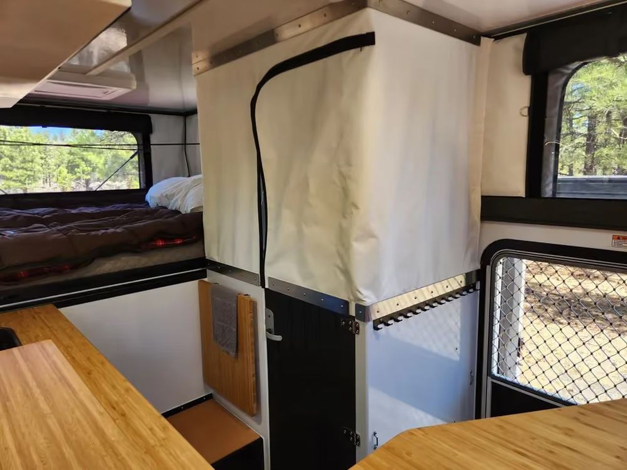 Hudson Bay Flatbed Pop-Up Truck Camper Fits Wet Bathroom, Without Cramping Up Kitchen